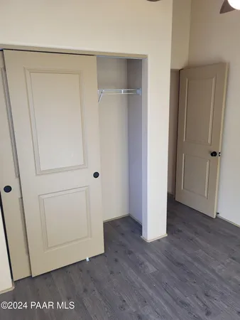 a view of room with window and hardwood floor