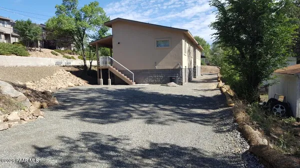 a view of hallway with wooden floor