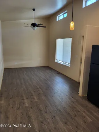 a kitchen with stainless steel appliances granite countertop a refrigerator and a stove