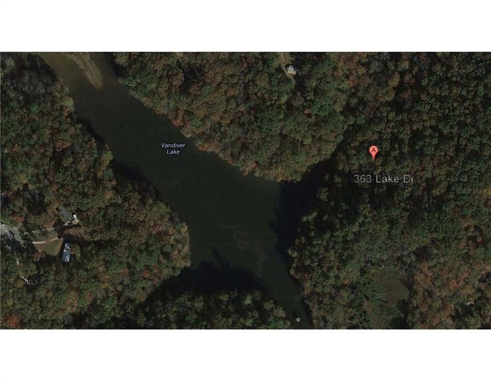 363 Maple Ridge Lake Court Dawsonville, GA 30534 - Photo 2 of 33 a black and white photo of a house