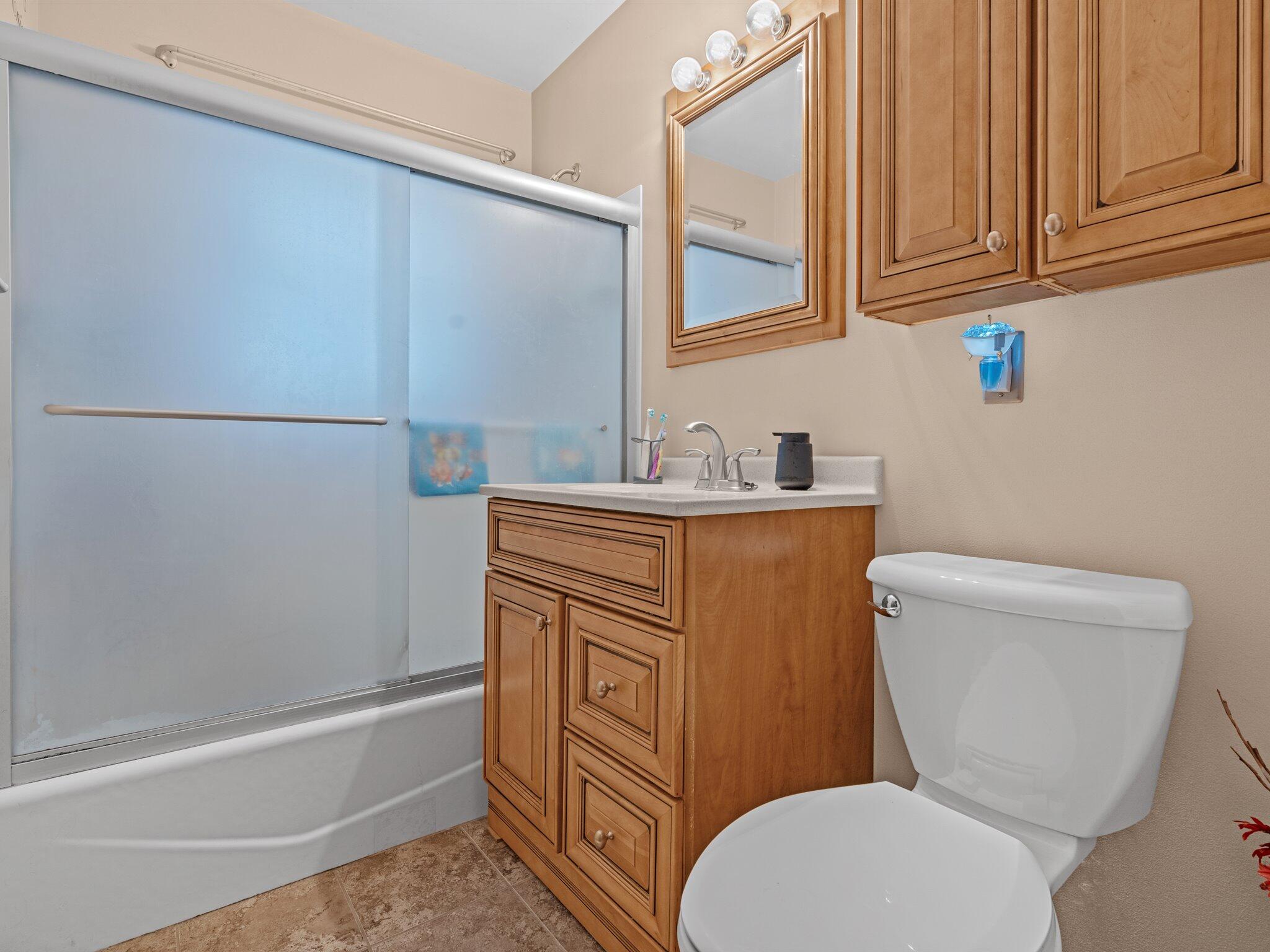 614 West Elm Street Griffith, IN 46319 - Photo 11 of 16 a bathroom with a sink a toilet and bathtub