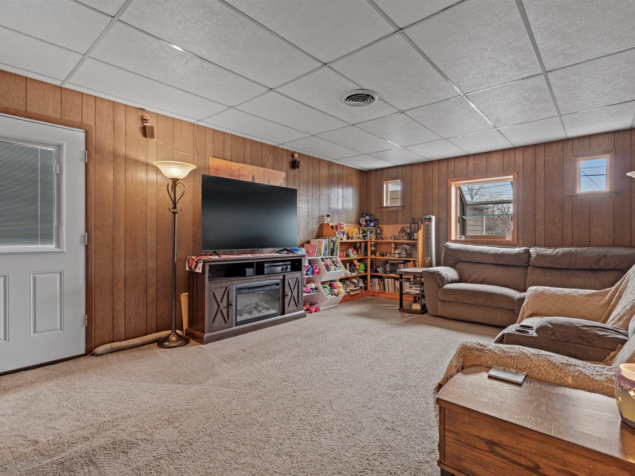 614 West Elm Street Griffith, IN 46319 - Photo 12 of 16 a living room with furniture and a flat screen tv