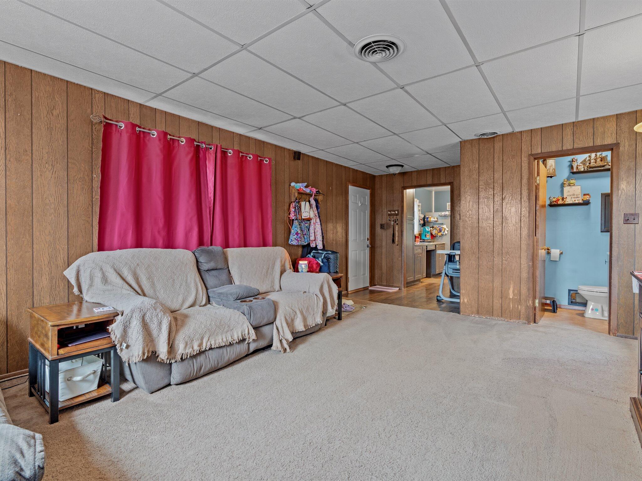 614 West Elm Street Griffith, IN 46319 - Photo 13 of 16 a living room with furniture and a flat screen tv