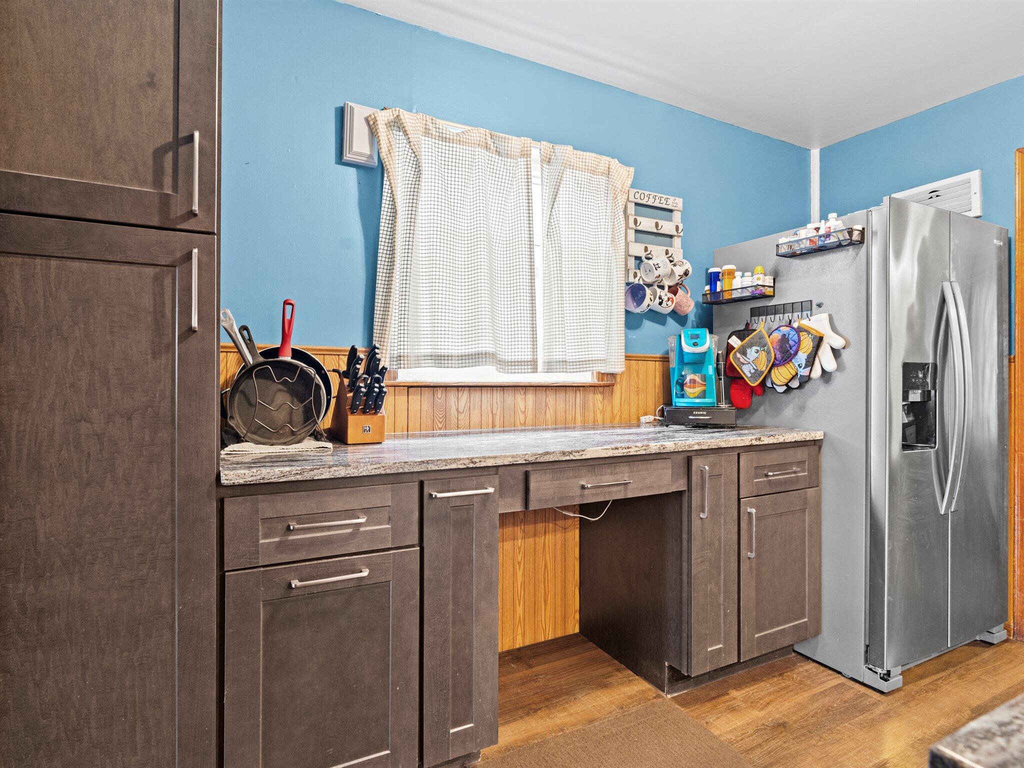 614 West Elm Street Griffith, IN 46319 - Photo 6 of 16 a kitchen with stainless steel appliances a sink and a refrigerator