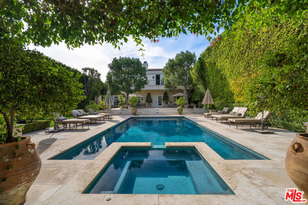 a view of a swimming pool with lounge chair