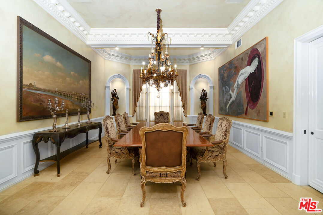 722 North Elm Drive Beverly Hills, CA 90210 - Photo 11 of 51 a view of a dining room with furniture and a chandelier
