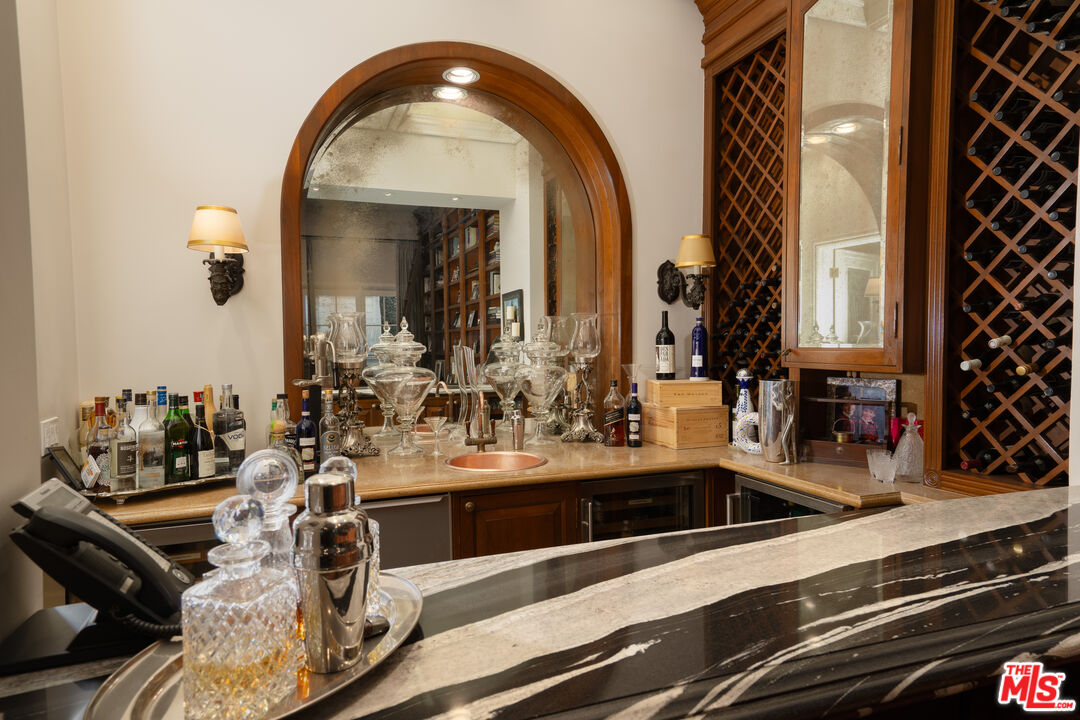 722 North Elm Drive Beverly Hills, CA 90210 - Photo 13 of 51 a view of a kitchen with a sink and cabinets