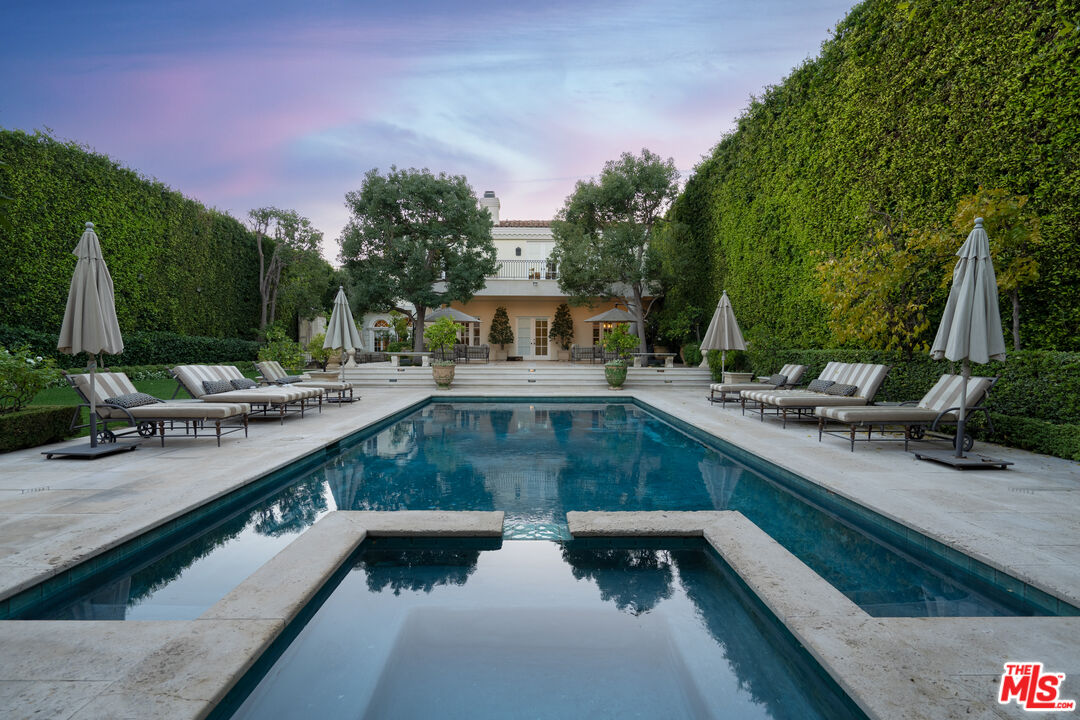 722 North Elm Drive Beverly Hills, CA 90210 - Photo 2 of 51 a view of swimming pool with outdoor seating and plants