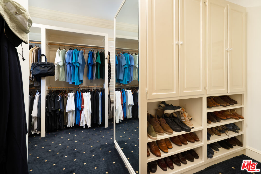 722 North Elm Drive Beverly Hills, CA 90210 - Photo 22 of 51 a view of walk in closet with clothes and shoes