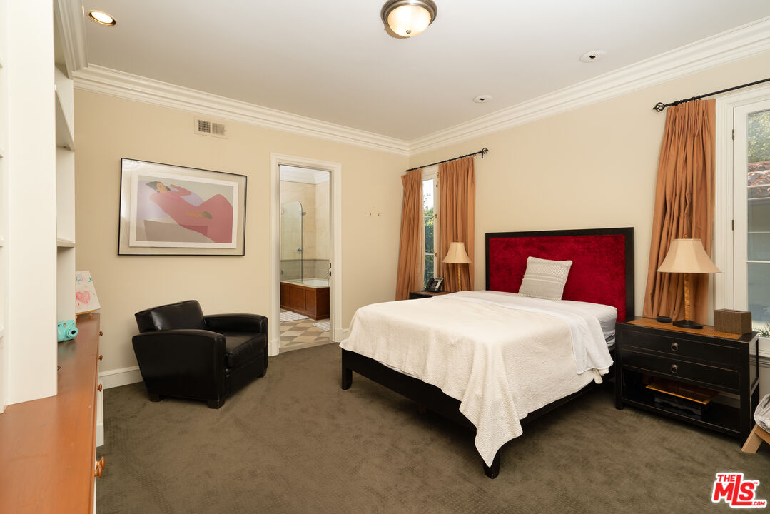 722 North Elm Drive Beverly Hills, CA 90210 - Photo 30 of 51 a bedroom with a bed and dresser