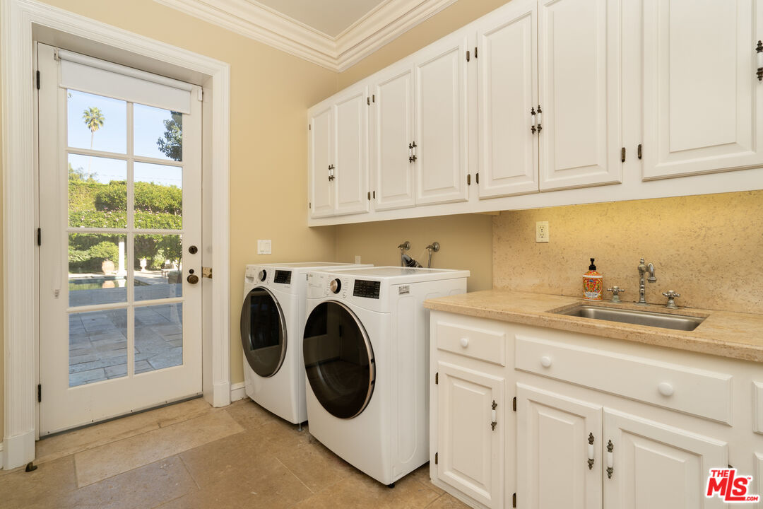 722 North Elm Drive Beverly Hills, CA 90210 - Photo 32 of 51 a utility room with sink dryer and washer