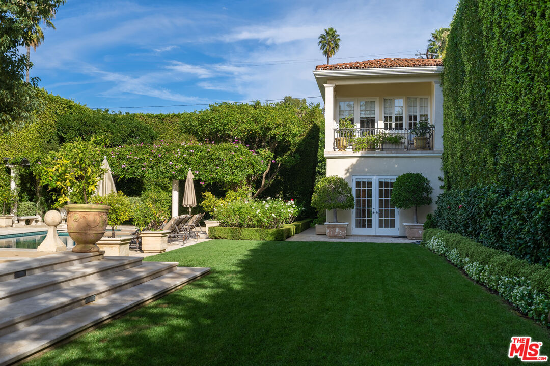 722 North Elm Drive Beverly Hills, CA 90210 - Photo 36 of 51 a view of a house with backyard and porch