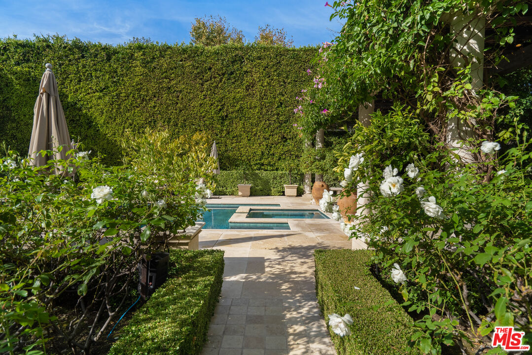722 North Elm Drive Beverly Hills, CA 90210 - Photo 37 of 51 a view of a yard with plants and a trees