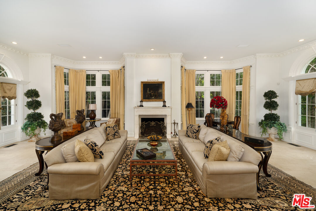 722 North Elm Drive Beverly Hills, CA 90210 - Photo 8 of 51 a living room with furniture fireplace and potted plant
