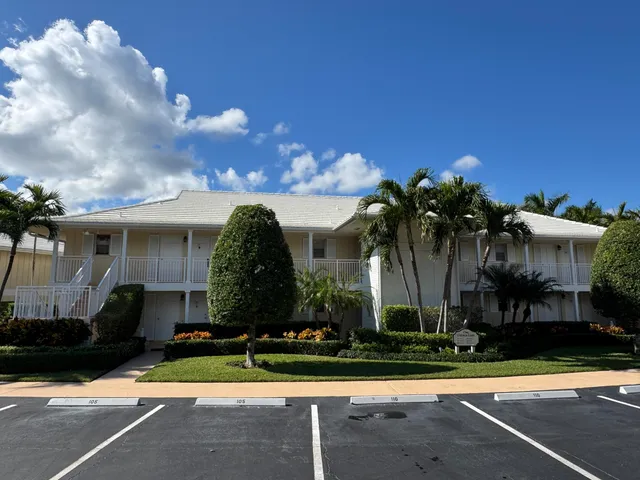 a view of a house with swimming pool and a yard