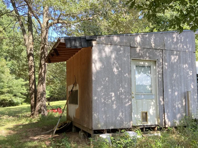 a view of a chair and table in the balcony