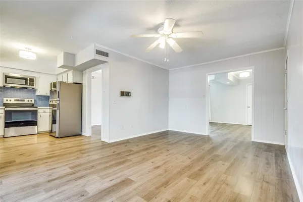 a view of a kitchen with a stove cabinets and wooden floor