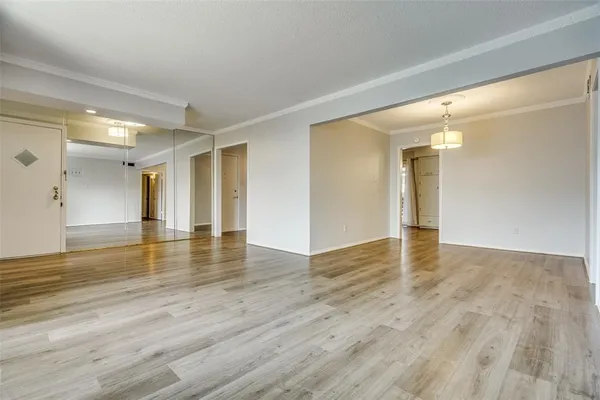a view of a livingroom with wooden floor