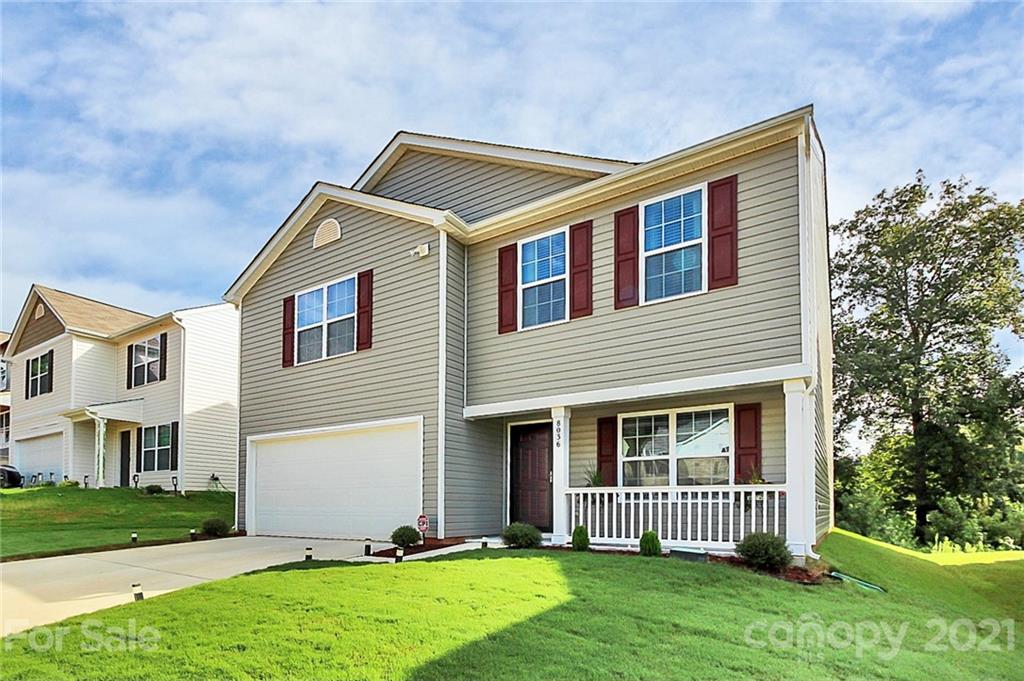 8036 Starnes Randall Road Charlotte, NC 28215 - Photo 2 of 45 a front view of a house with a yard