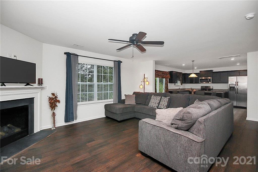 8036 Starnes Randall Road Charlotte, NC 28215 - Photo 19 of 45 a living room with furniture and a fireplace