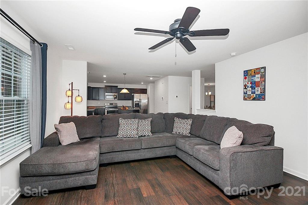 8036 Starnes Randall Road Charlotte, NC 28215 - Photo 20 of 45 a living room with furniture and a view of kitchen