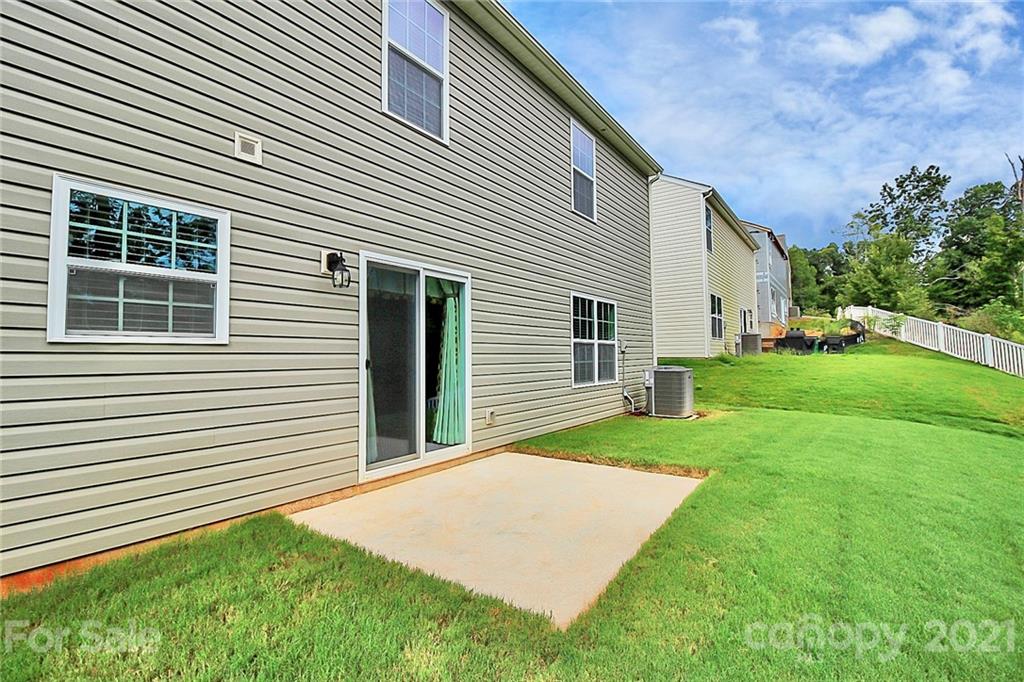 8036 Starnes Randall Road Charlotte, NC 28215 - Photo 41 of 45 a front view of a house with a yard