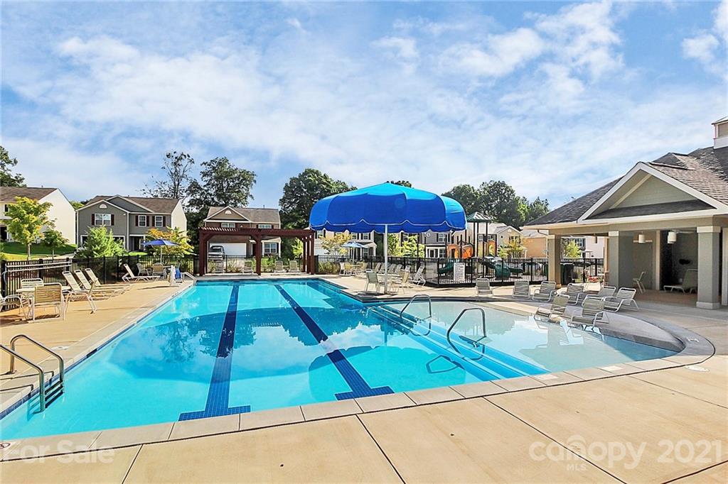 8036 Starnes Randall Road Charlotte, NC 28215 - Photo 43 of 45 a view of a patio with swimming pool table and chairs