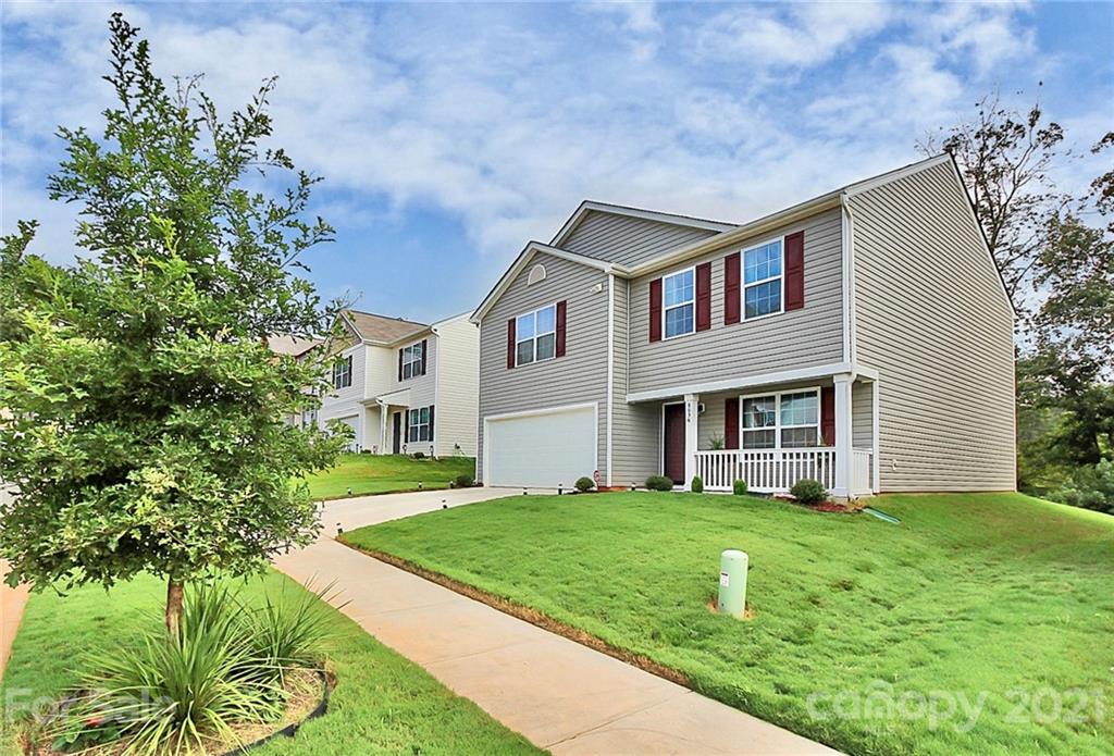8036 Starnes Randall Road Charlotte, NC 28215 - Photo 45 of 45 a front view of a house with a yard