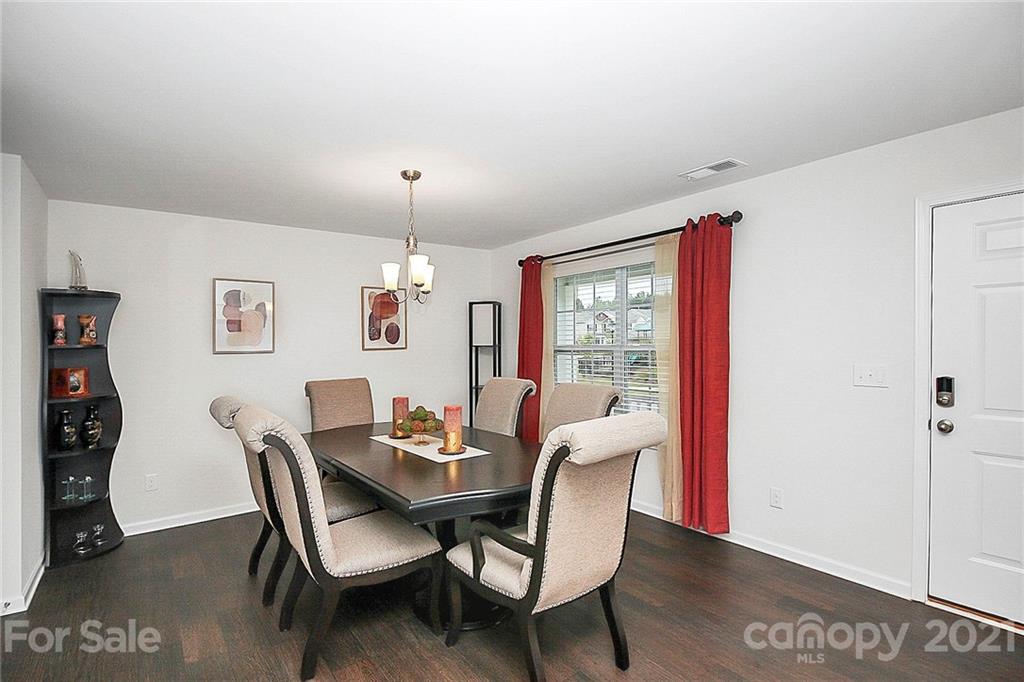 8036 Starnes Randall Road Charlotte, NC 28215 - Photo 7 of 45 a dining room with furniture and window