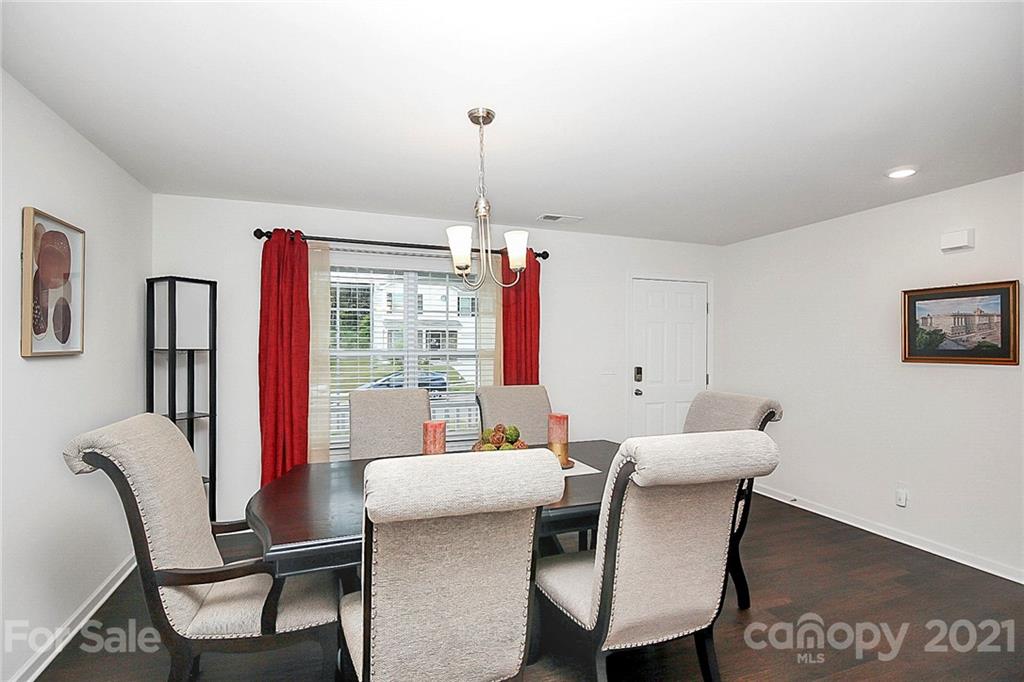 8036 Starnes Randall Road Charlotte, NC 28215 - Photo 8 of 45 a dining room with furniture and window