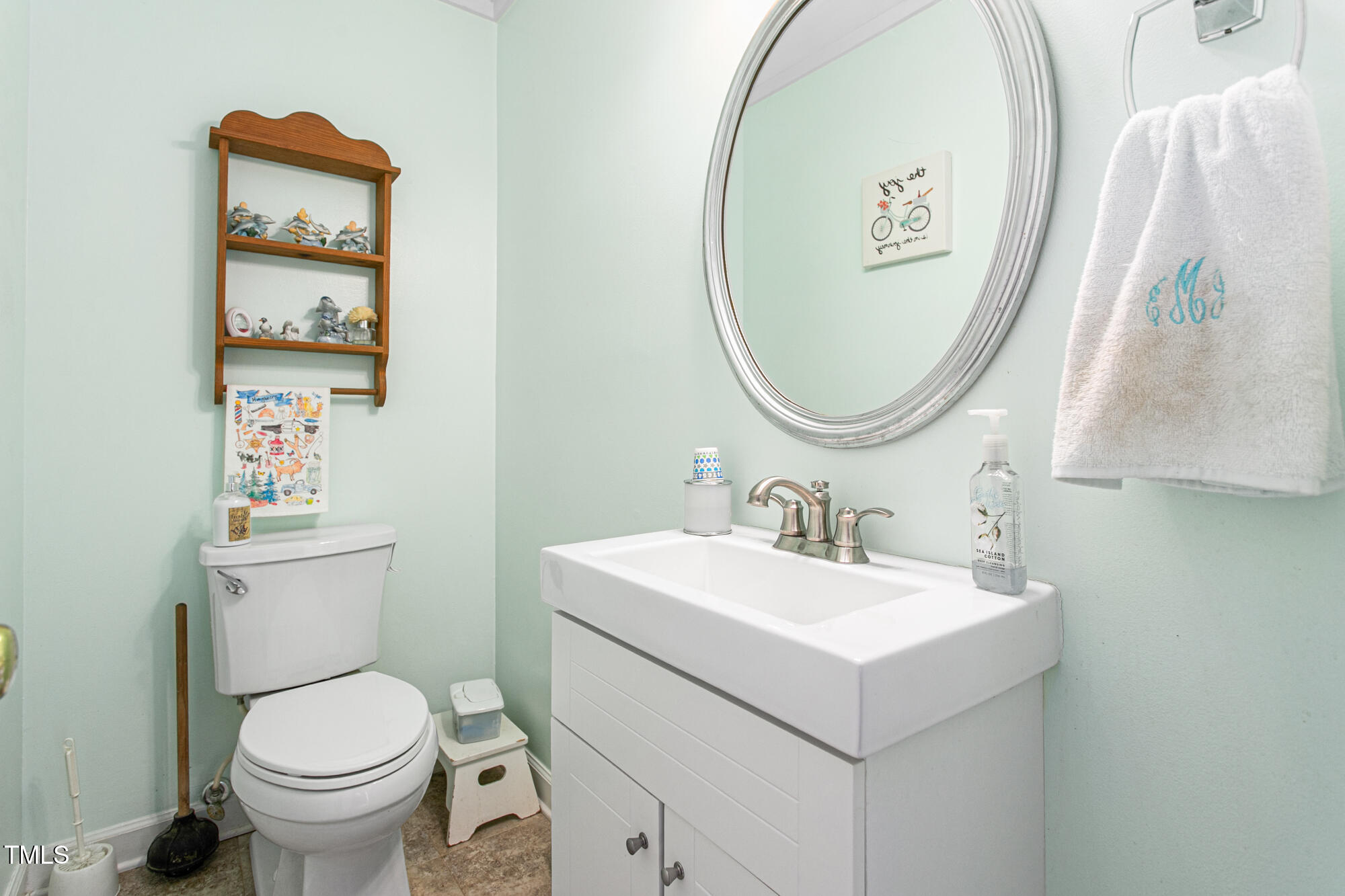 809 Brookview Drive Elon, NC 27244 - Photo 18 of 53 a bathroom with a toilet sink and mirror