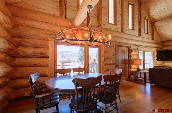 a view of room with window and a ceiling fan