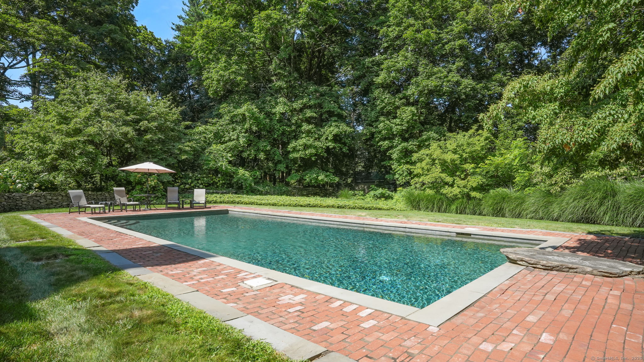 79 Hilltop Road Sharon, CT 06069 - Photo 26 of 31 a view of a swimming pool with a backyard