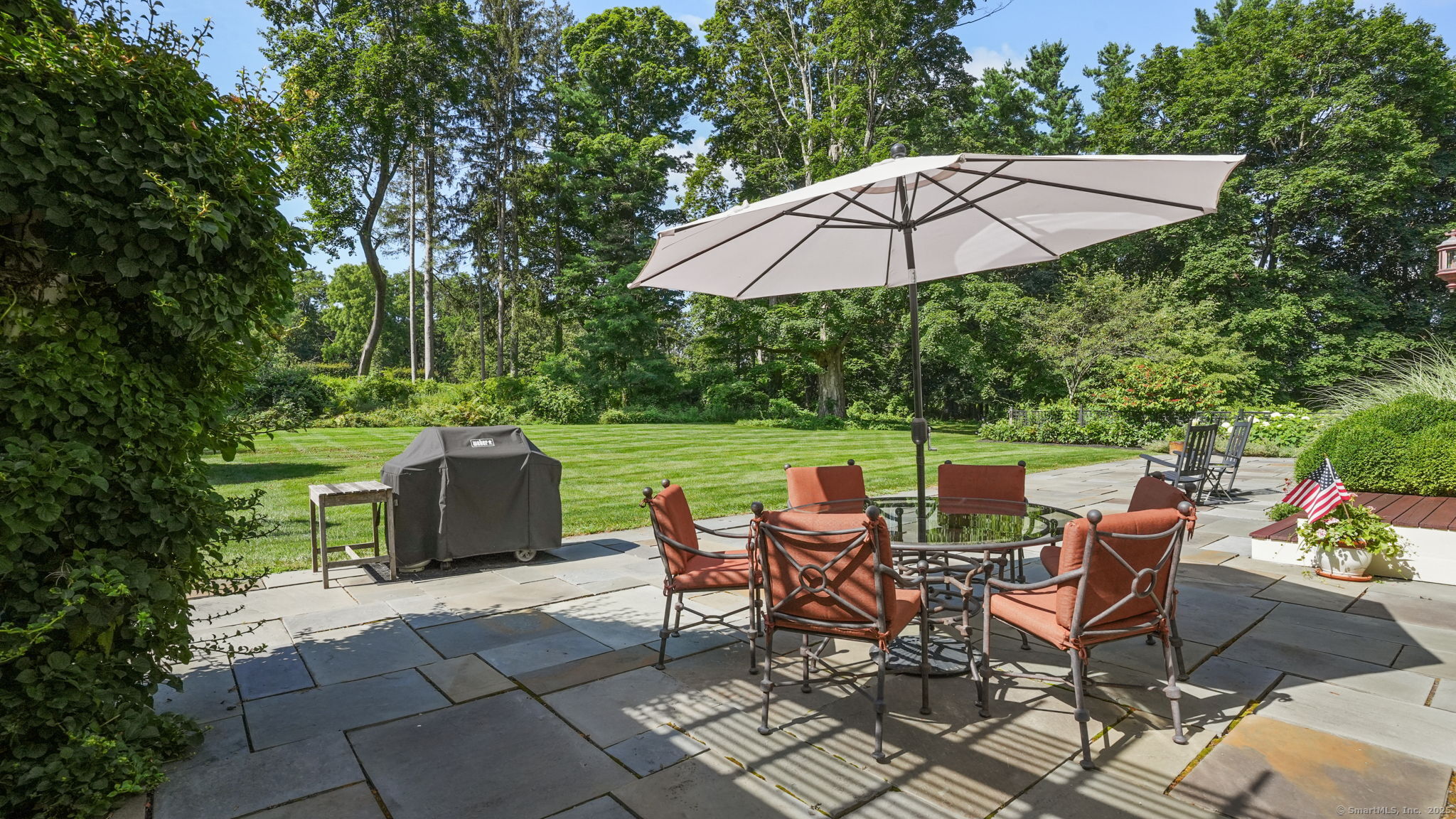 79 Hilltop Road Sharon, CT 06069 - Photo 29 of 31 a view of patio with table and chairs under an umbrella