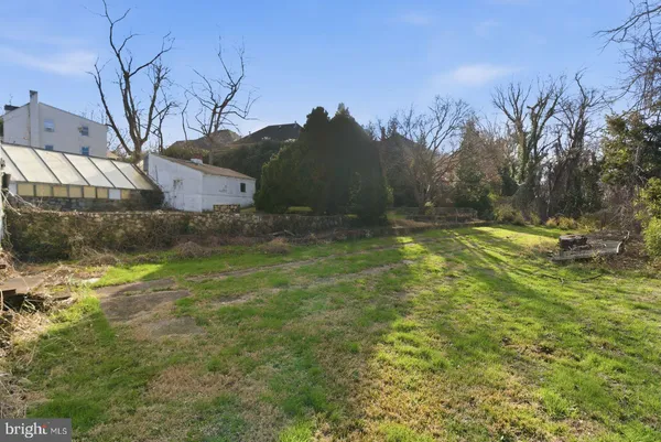 a view of backyard with green space