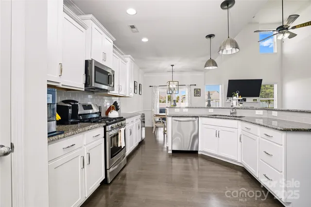 a kitchen with a sink and a window