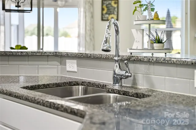 a kitchen with a stove and cabinets