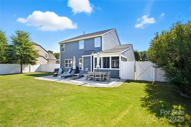 a view of yard with swimming pool and green space