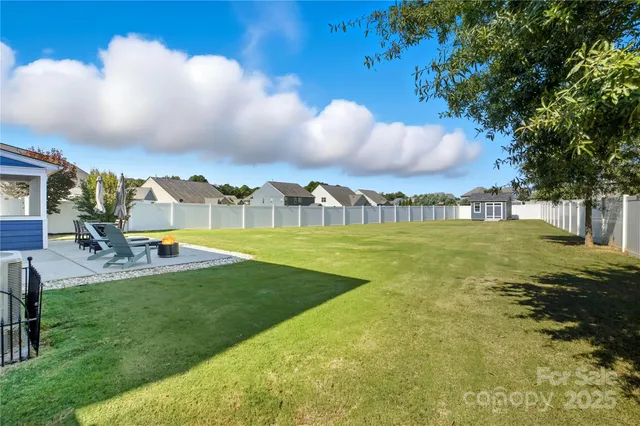 a view of a swimming pool with a yard