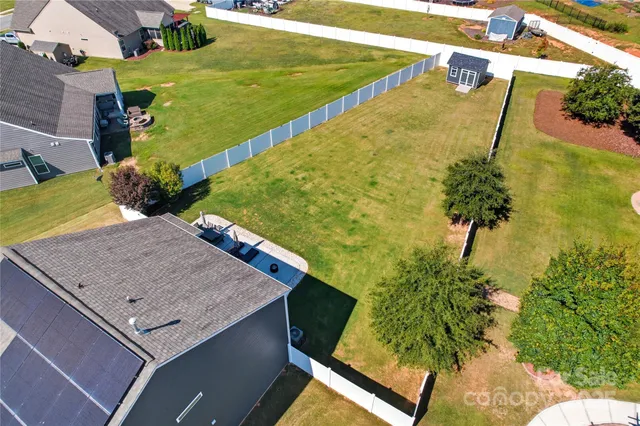 a view of a swimming pool and lounge chairs