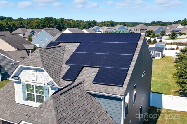 a view of a swimming pool with an outdoor seating and a garden