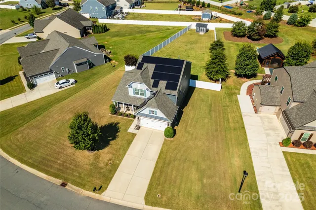 an aerial view of a residential apartment building with a swimming pool