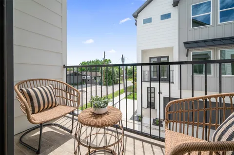 a view of balcony with wooden floor