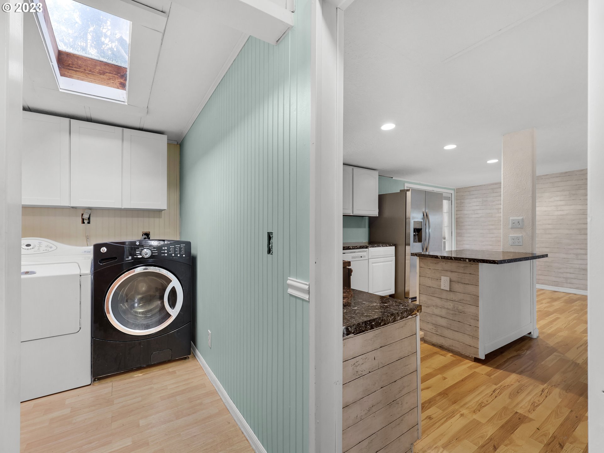 92287 Walluski Loop Astoria, OR 97103 - Photo 11 of 39 a view of a kitchen with a sink cabinets and wooden floor