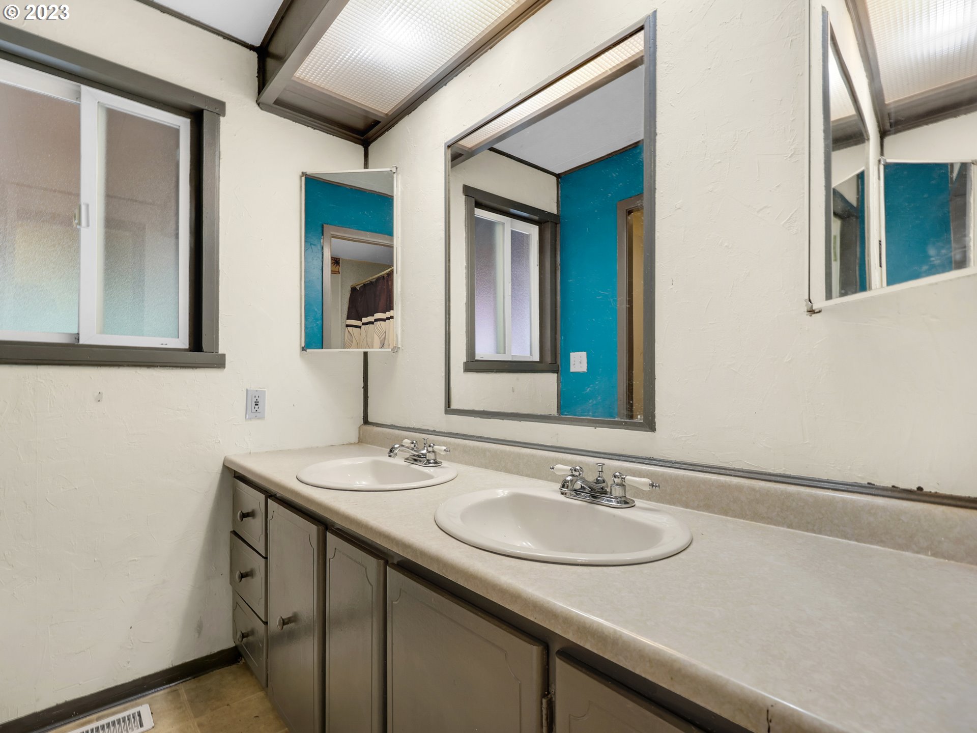 92287 Walluski Loop Astoria, OR 97103 - Photo 15 of 39 a bathroom with a sink and a mirror