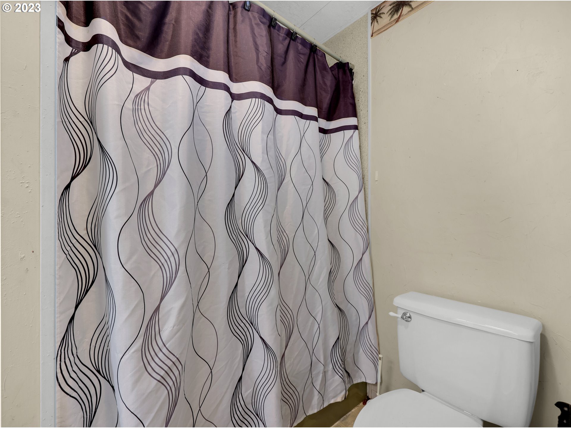 92287 Walluski Loop Astoria, OR 97103 - Photo 16 of 39 a bathroom with a bathtub and a toilet