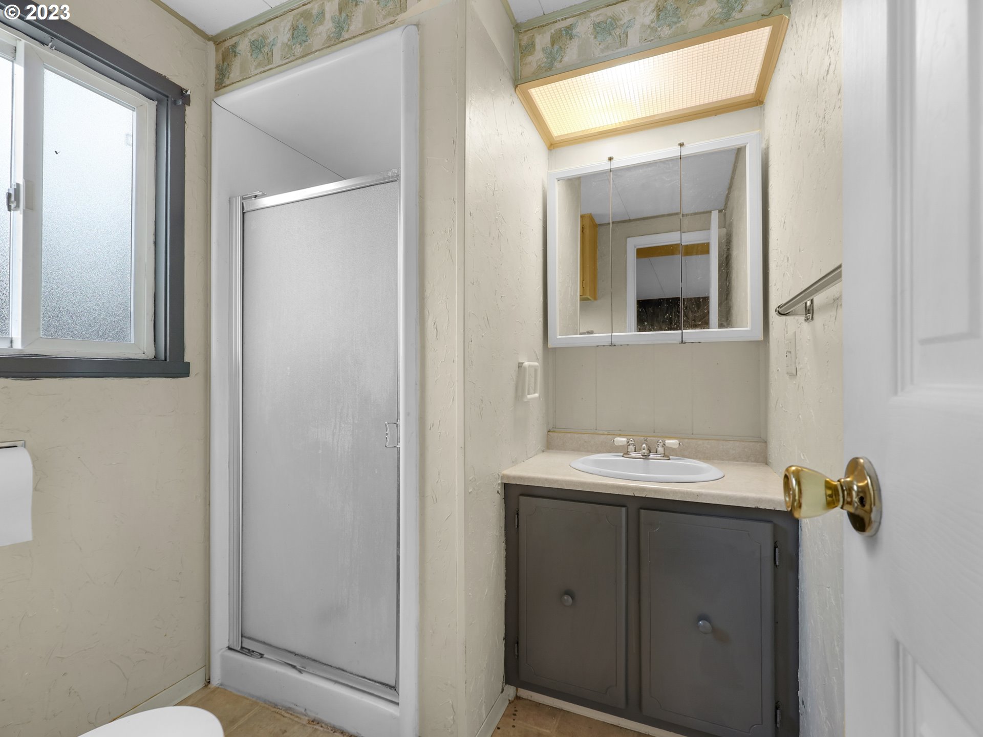 92287 Walluski Loop Astoria, OR 97103 - Photo 19 of 39 a bathroom with a sink a toilet and mirror