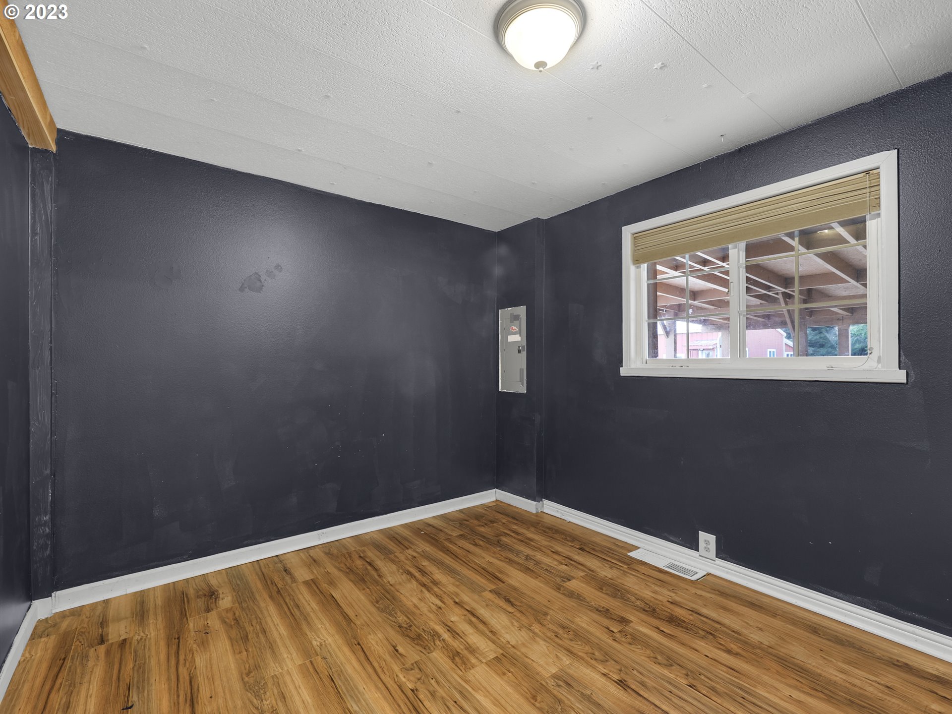 92287 Walluski Loop Astoria, OR 97103 - Photo 20 of 39 a view of empty room with wooden floor