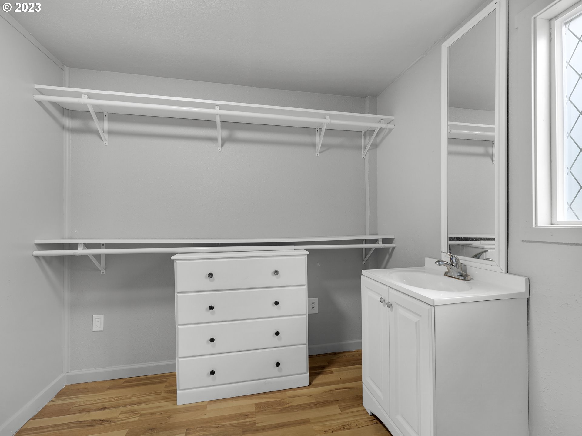 92287 Walluski Loop Astoria, OR 97103 - Photo 30 of 39 a view of cabinets and utility room with closet