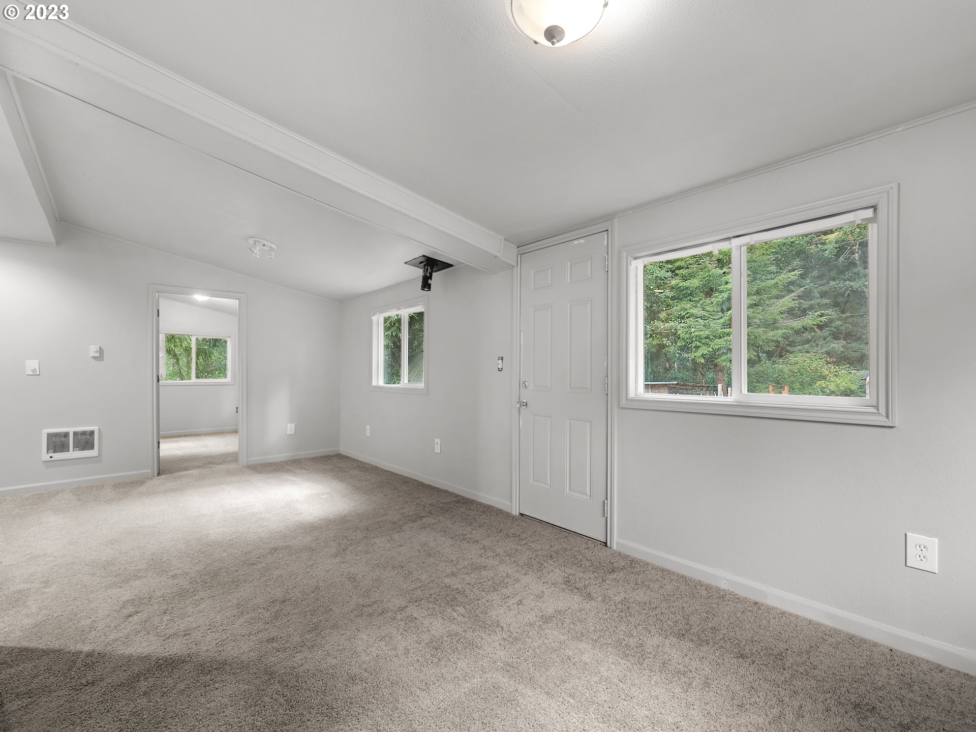 92287 Walluski Loop Astoria, OR 97103 - Photo 31 of 39 an empty room with windows